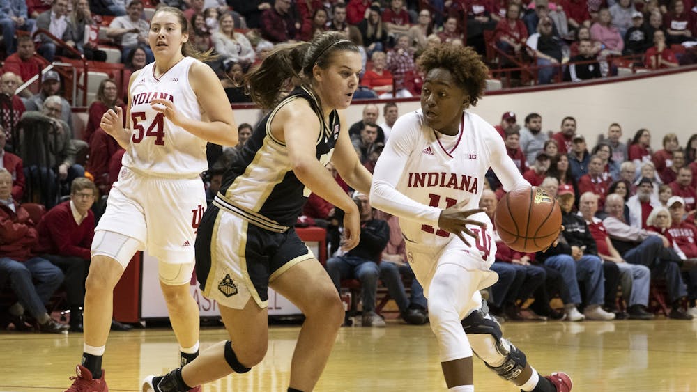 Freshman Chanel Wilson dribbles around a Purdue defender Jan. 9 at Simon Skjodt Assembly Hall.
