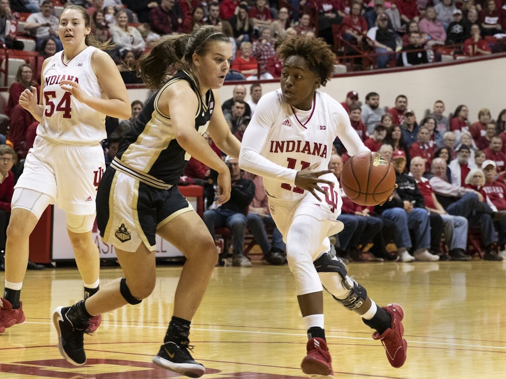Freshman Chanel Wilson dribbles around a Purdue defender Jan. 9 at Simon Skjodt Assembly Hall.