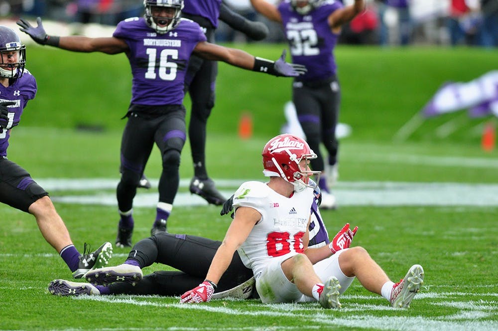 Sophomore wide receiver Luke Timian gets off the field after a pass intended for him results in an interception.