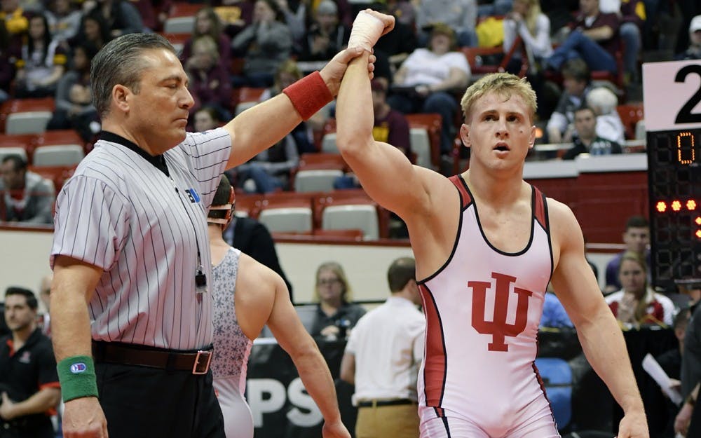 <p>Then-sophomore, now senior Jake Danishek gets his hand raised after a win at the 2016 Big Ten wrestling championships. Danishek and IU will host Maryland in the first competition at Wilkinson Hall.</p>
