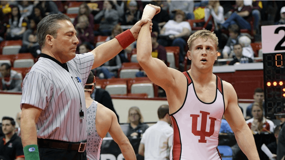 Then-sophomore, now senior Jake Danishek gets his hand raised after a win at the 2016 Big Ten wrestling championships. Danishek and IU will host Maryland in the first competition at Wilkinson Hall.