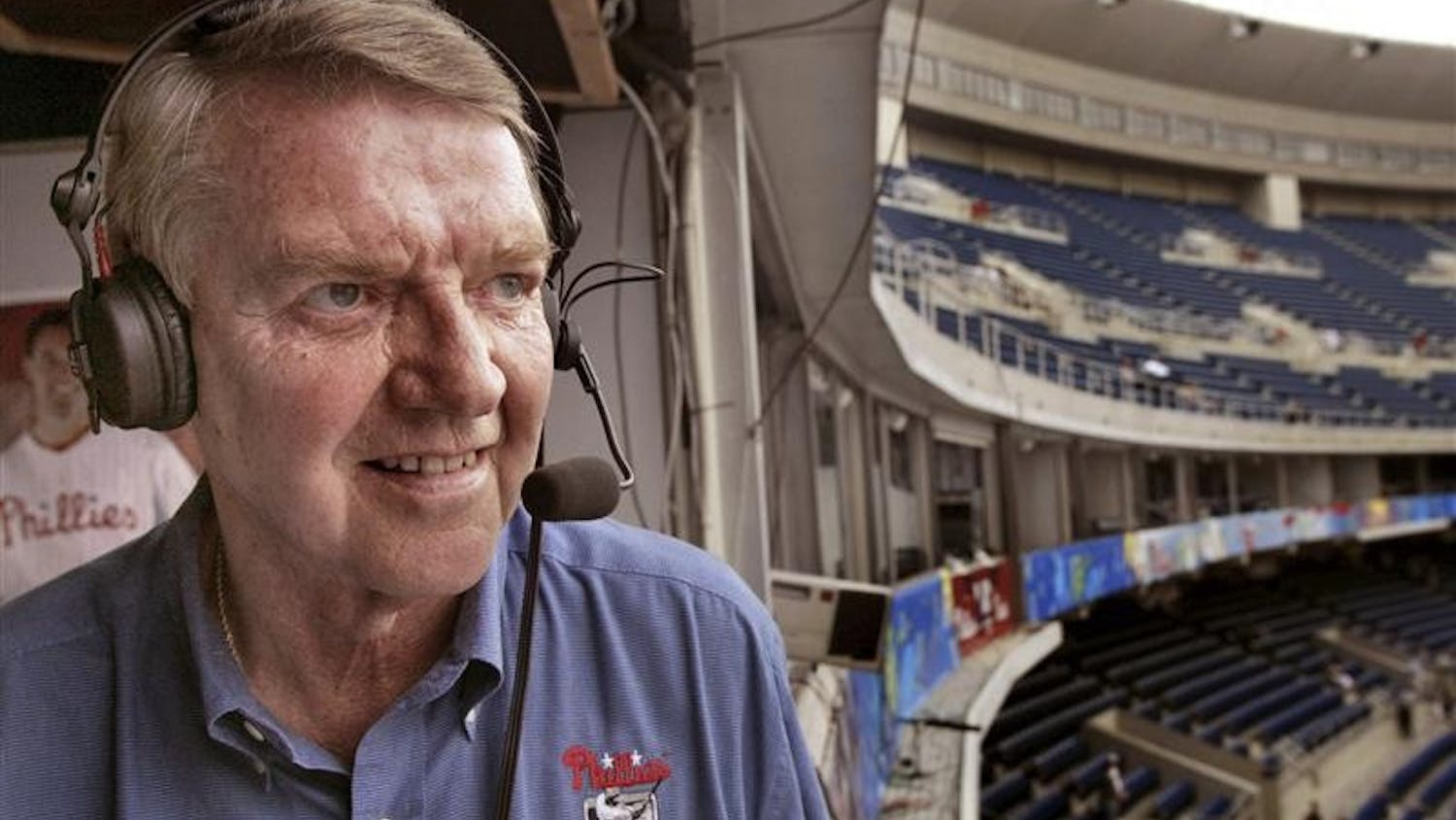 In this July 2, 2002 file photo, Philadelphia Phillies announcer Harry Kalas looks out over Veterans Stadium in Philadelphia before the start of the New York Mets-Phillies game.  Kalas, who punctuated innumerable home runs with his "Outta Here!" call, died Monday after being found in the broadcast booth before a game against the Washington Nationals. He was 73. 