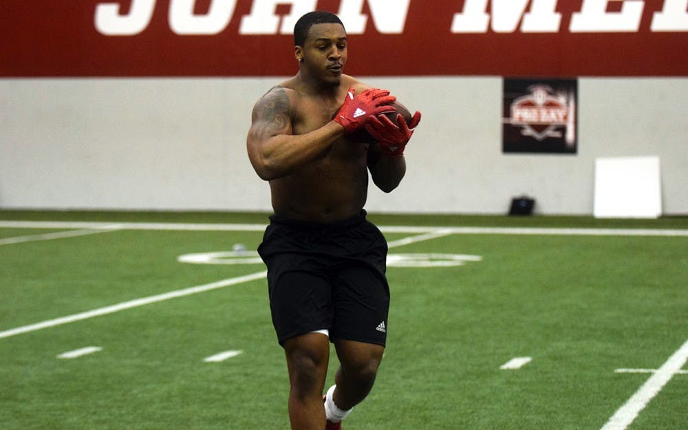 Senior linebacker Clyde Newton catches a ball during IU's Pro Day on Friday in Mellencamp Pavilion. Newton had a personal best broad jump distance of 9'8'' and a time of 4.64 seconds in the 40-yard dash.