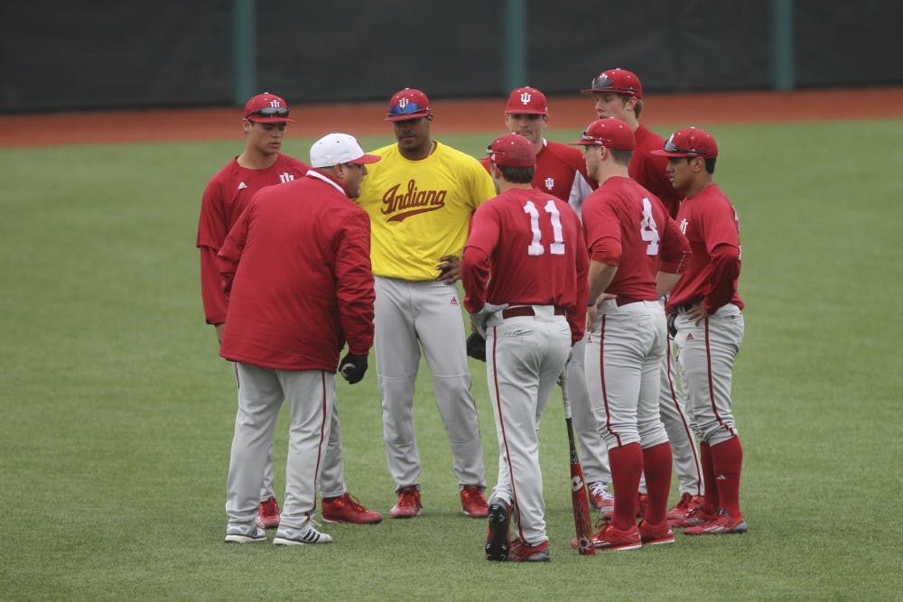 Head coach Chris Lemonis talks to members of the baseball team during practice on Wednesday at Bart Kaufman Field.