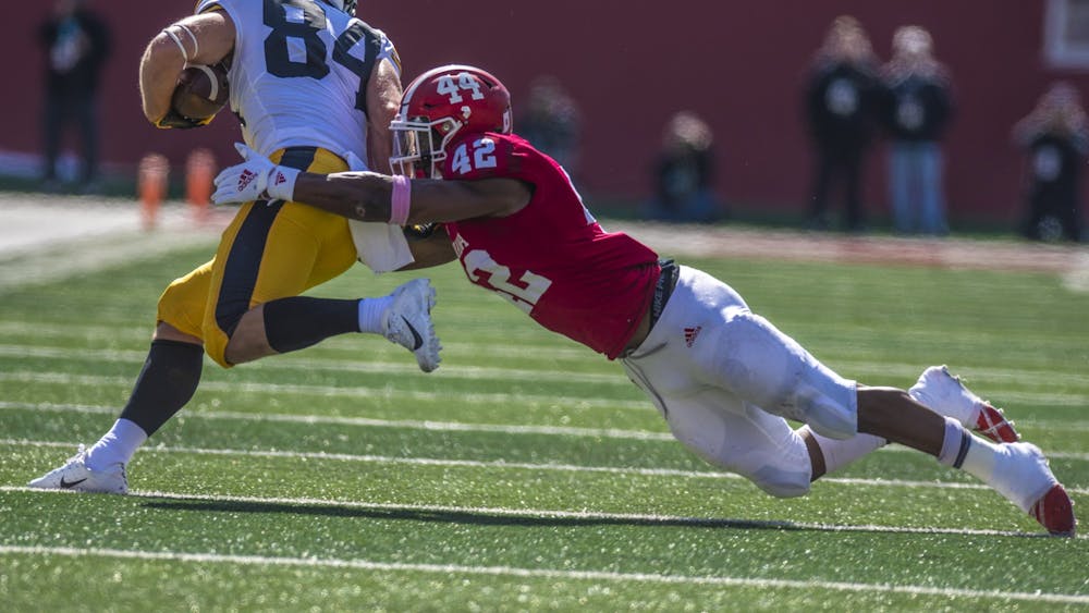 Then-sophomore defensive back Marcelino Ball attempts to tackle Iowa then-senior wide receiver Nick Easley during the homecoming game Oct. 13, 2018, at Memorial Stadium. No. 17 IU opens its season against No. 18 Iowa on Saturday in Iowa City, Iowa.