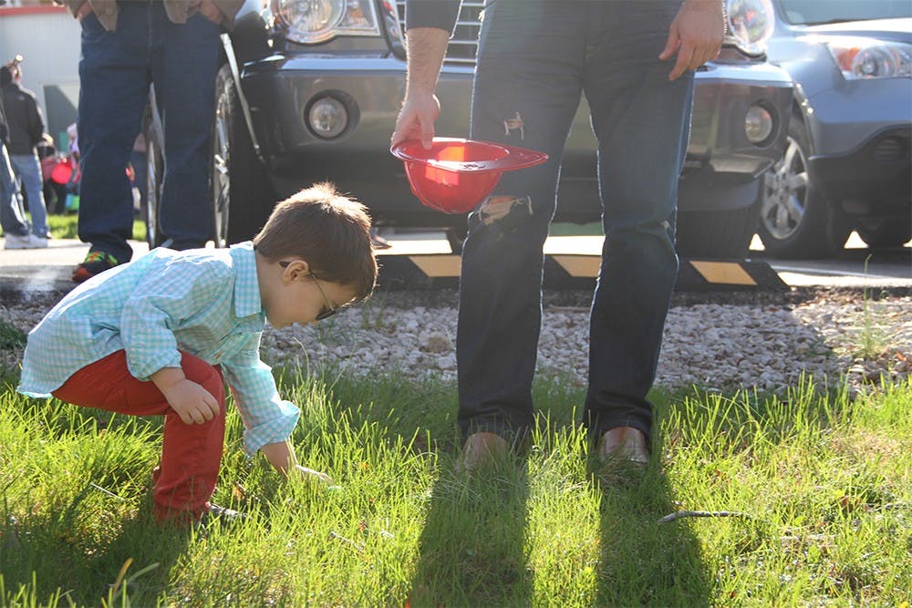 Ryker Dodd, 4, searches for Easter eggs during the Bloomington Township Fire Department's age-appropriate Easter egg hunt