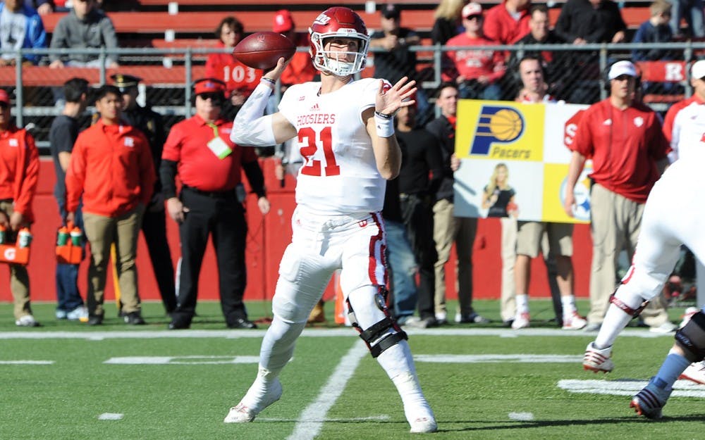 Junior quarterback Richard Lagow attempts a pass during IU’s game against Rutgers Saturday. Lagow threw for 394 yards, three touchdowns and two interceptions in IU’s 33-27 win.
