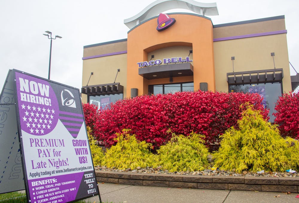 <p>A hiring sign is seen outside of the Taco Bell on Nov. 11, 2021, on East Third Street.</p>