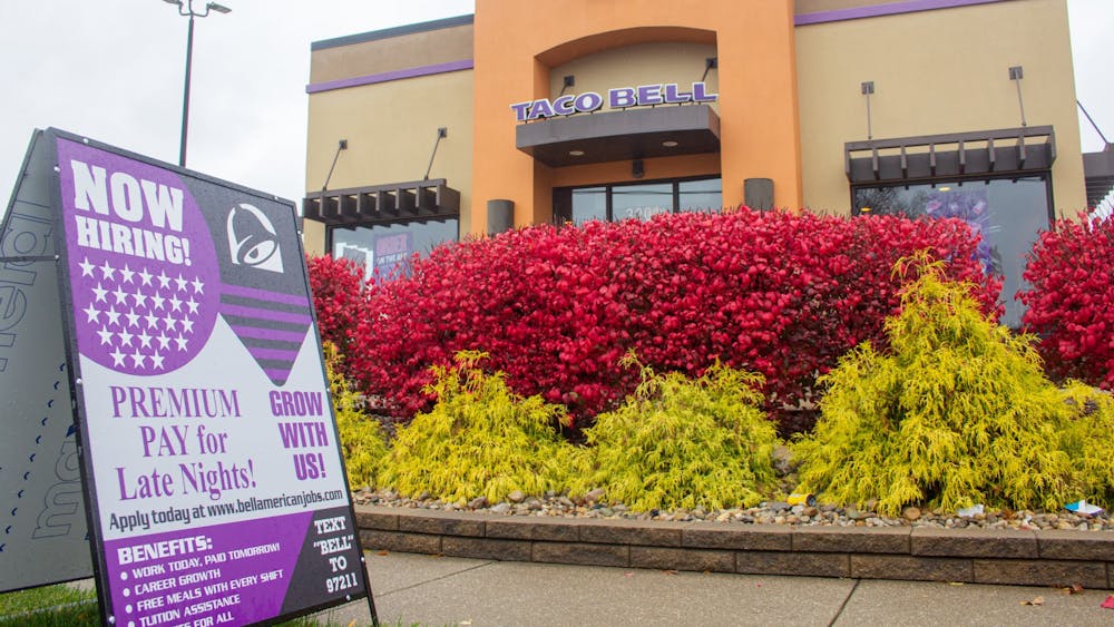 A hiring sign is seen outside of the Taco Bell on Nov. 11, 2021, on East Third Street.