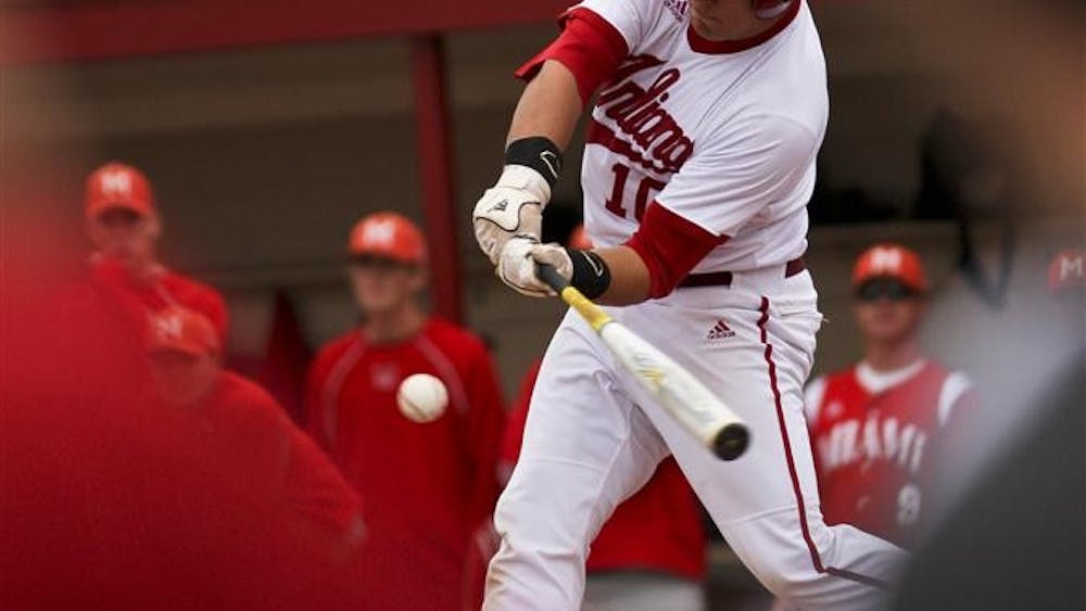 Freshman Kyle Schwarber at bat, watched from the dugout by his teammates and coaches Tuesday at Sembower Field.