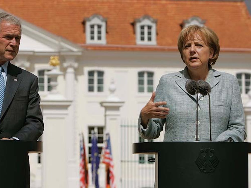 U.S .President George W. Bush, left, is seen with German Chancellor Angela Merkel, right, during their joint news conference at Schloss Meseberg Palace, Wednesday, June 11, 2008 in Meseberg, Germany. (AP Photo/Pablo Martinez Monsivais)