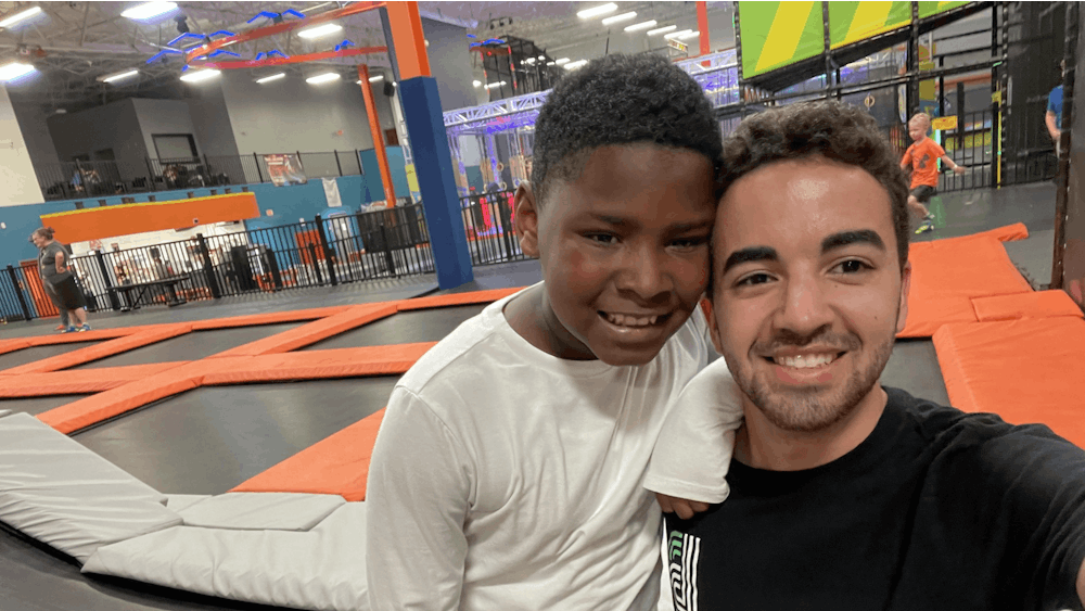 President of Big Brothers Big Sisters at IU Chris Brake and his &quot;little brother&quot; Tirvell spend time together at Urban Air. About half of the volunteers in Big Brothers Big Sisters of South Central Indiana are IU students, Danell Witmer, executive director of BBBSSCI, said. 