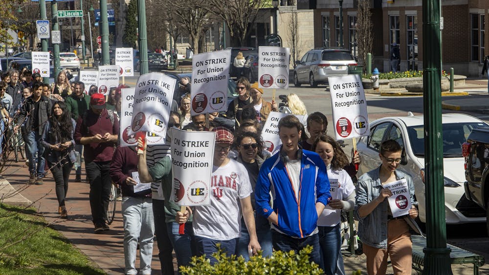Attendees of the vote for a graduate student union walk west on Kirkwood Avenue towards Switchyard Brewing Company on April 10, 2022. The vote will decide if the graduate students will go on strike on Wednesday.