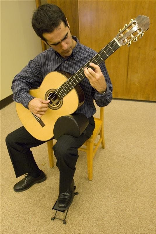 IU grad student Efrain Hoyos-Escobar plays "Prelude No. 2" by Heitor Villa-Lobos providing musical entertainment during a kickoff event for Hispanic Heritage Month on Monday evening in the Mathers Museum. The event also featured free food, the presentation of a new exhibit in the Mathers Museum created by IU grad student Selina Morales, and several speakers informing attendees about upcoming events and hispanic history.