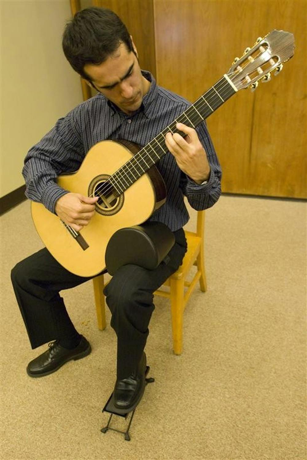 IU grad student Efrain Hoyos-Escobar plays "Prelude No. 2" by Heitor Villa-Lobos providing musical entertainment during a kickoff event for Hispanic Heritage Month on Monday evening in the Mathers Museum. The event also featured free food, the presentation of a new exhibit in the Mathers Museum created by IU grad student Selina Morales, and several speakers informing attendees about upcoming events and hispanic history.