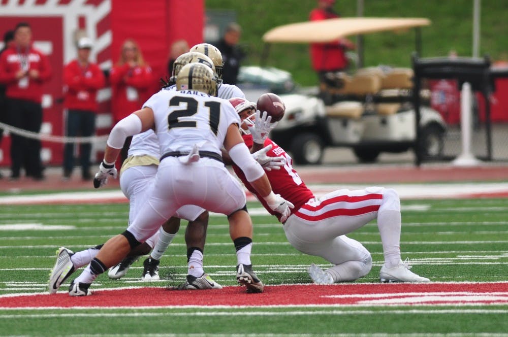 Junior quarterback Richard Lagow's pass is nearly intercepted during the first quarter on Saturday at Memorial Stadium. IU leads Purdue 17-16 at halftime.