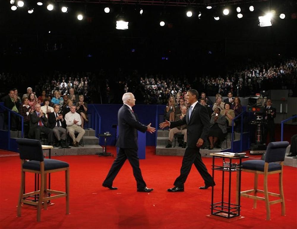 Democratic presidential candidate Sen. Barack Obama, D-Ill., right, and Republican presidential candidate Sen. John McCain, R-Ariz., shake hands before the start of the town hall-style presidential debate on Tuesday at Belmont University in Nashville, Tenn.