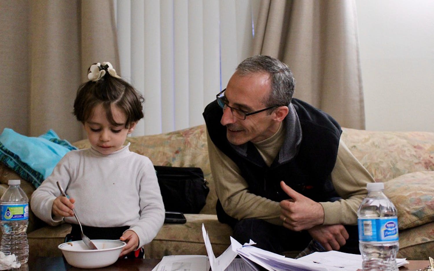 Mohamed Lababidi teases daughter Remas about her afternoon ice cream snack. A house painter in Syria, Mohamed is now struggling to find&nbsp;a job that doesn't require a lot of English.&nbsp;