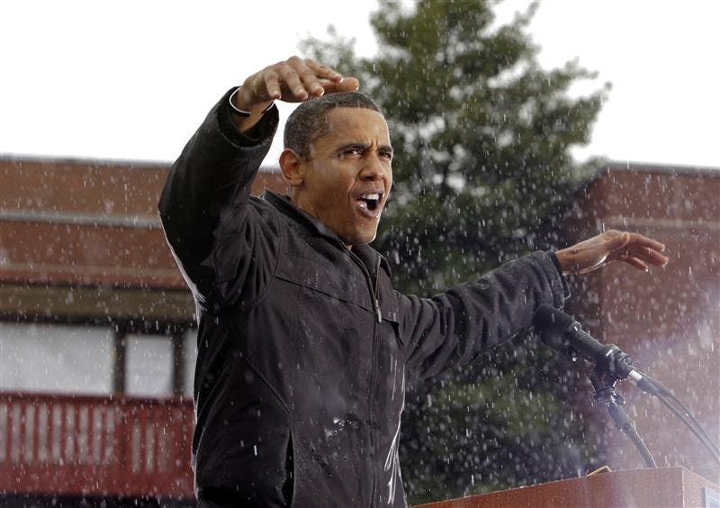 Democratic presidential candidate Sen. Barack Obama, D-Ill. gestures as he speaks in the rain during a rally Tuesday in Chester, Pa.