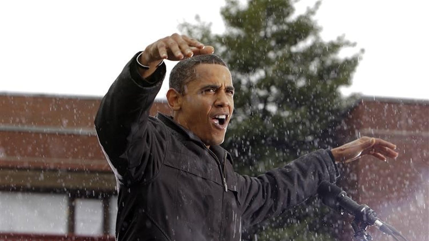 Democratic presidential candidate Sen. Barack Obama, D-Ill. gestures as he speaks in the rain during a rally Tuesday in Chester, Pa.