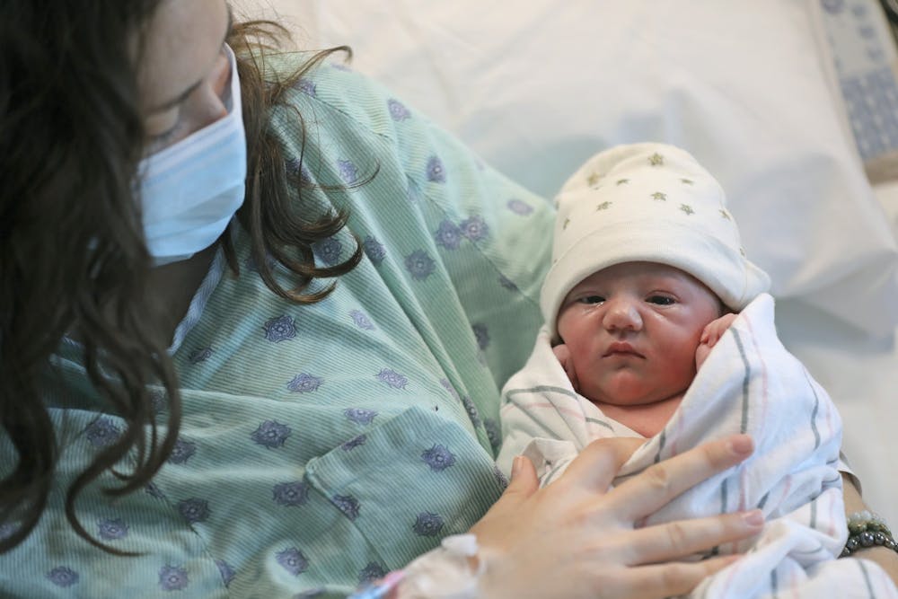 Naomi Ramirez holds her newborn baby Nahla Ramirez on Dec. 5, 2021, at the IU Health Bloomington facility. Nahla Ramirez is the first baby born at IU Health Bloomington, which opened its doors for patients on Sunday. 