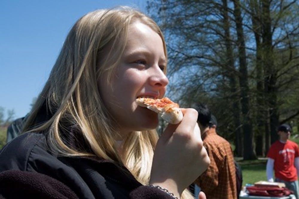 IDS FILE PHOTO
Freshman Anna Millies tastes a slice of pizza at Pizza Mania Friday, April 13, 2007 in Dunn Meadow.