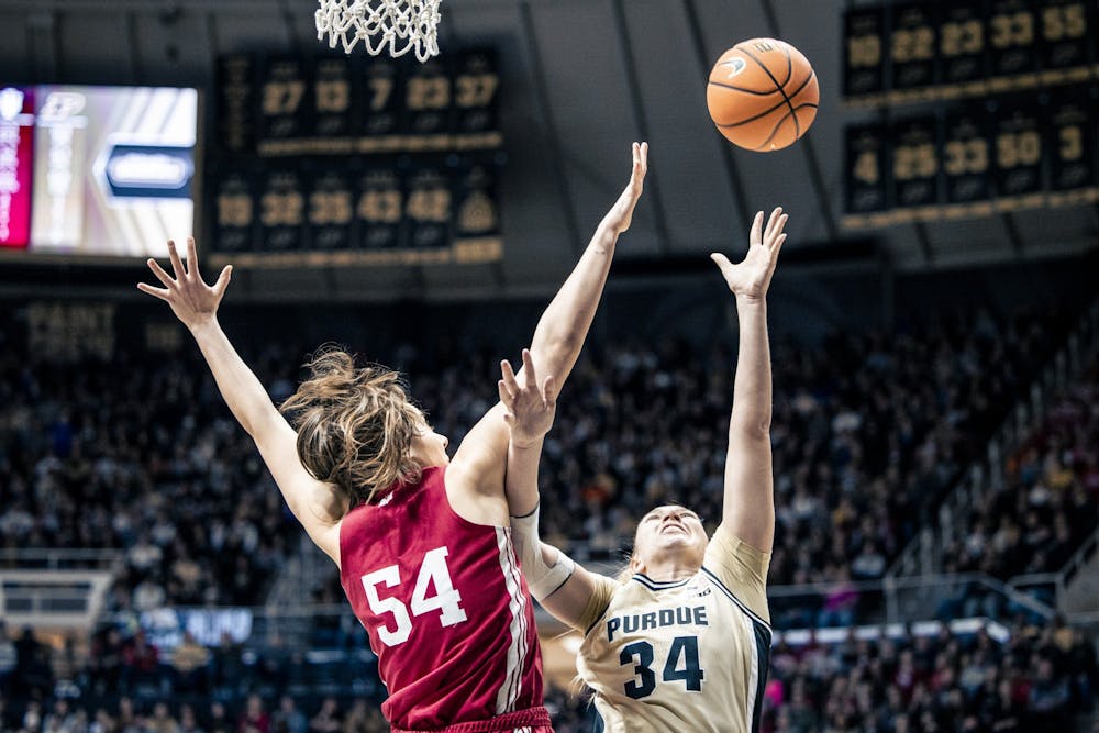 <p>Senior forward Mackenzie Holmes attempts to block a shot in West Lafayette on Feb. 5, 2023. Holmes moved into second place on Indiana&#x27;s all-time blocks list.</p>