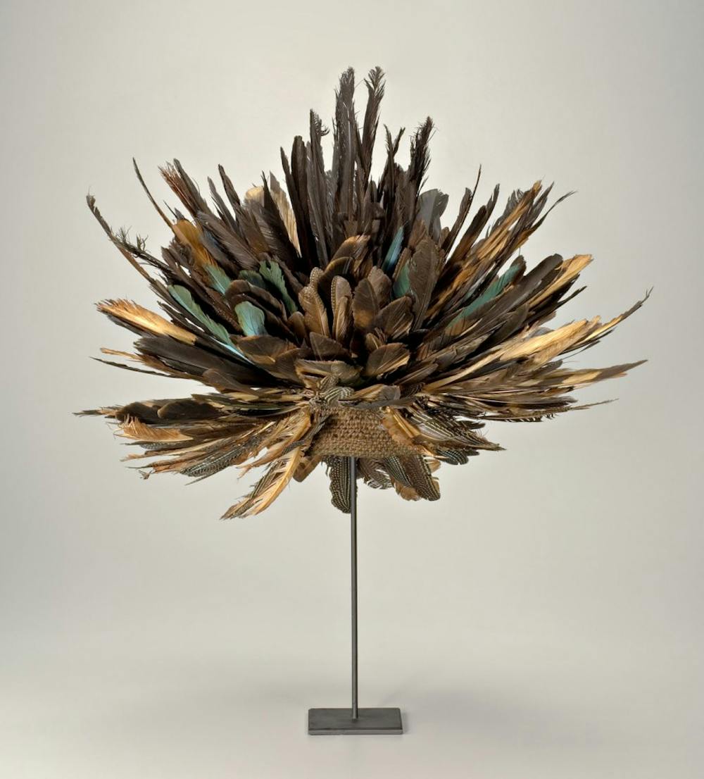 <p>Prestige Hat was on display at Eskenazi Museum of Art. This piece of art was created by an unknown artist in Cameroon with feathers and jute.&nbsp;</p>