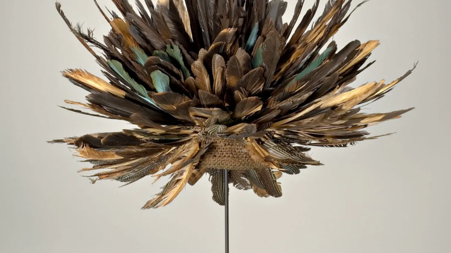 Prestige Hat was on display at Eskenazi Museum of Art. This piece of art was created by an unknown artist in Cameroon with feathers and jute. 