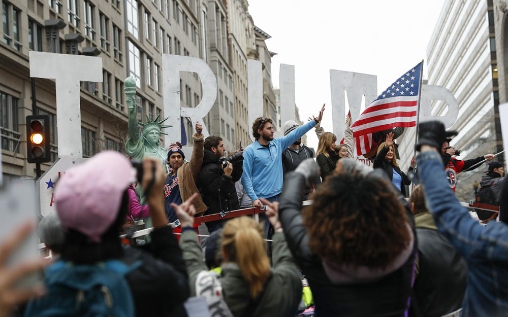 Trump supporters wave from a float at the Women's March on Washington protestors in Washington, D.C. on Jan. 21.