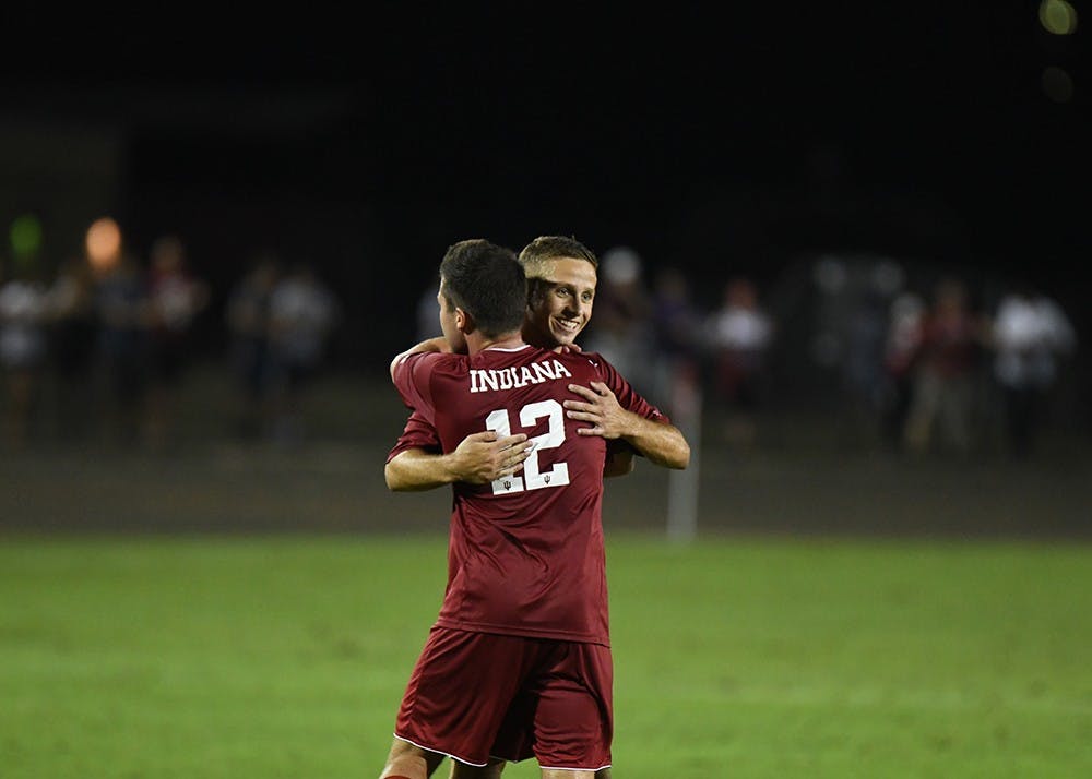 Then-junior midfielder Austin Panchot celebrates with teammate Rece Buckmaster after scoring a goal against Notre Dame on Sept. 26, 2017, at Bill Armstrong Stadium. IU will host the Adidas/IU Credit Union Classic this weekend.&nbsp;