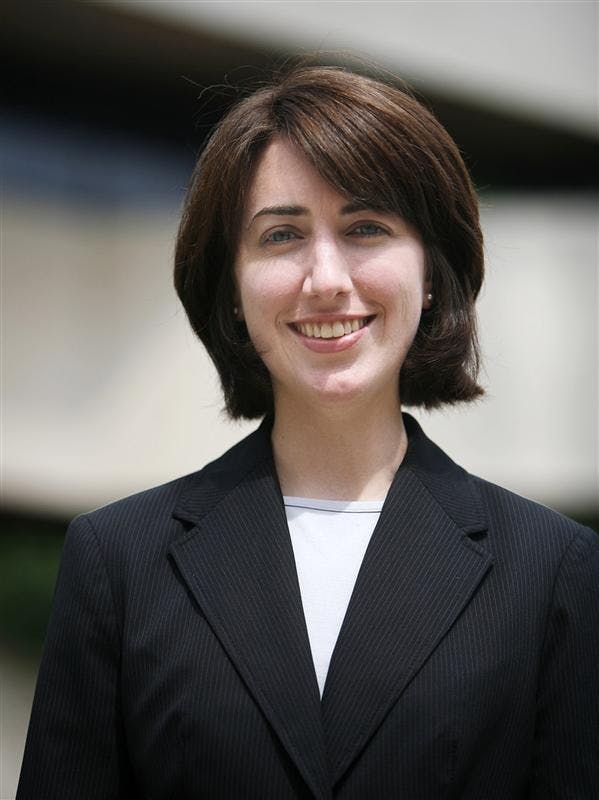 Newly appointed Director of Undergraduate Programming, Kathleen Robbins, stands for a portrait outside the business school.