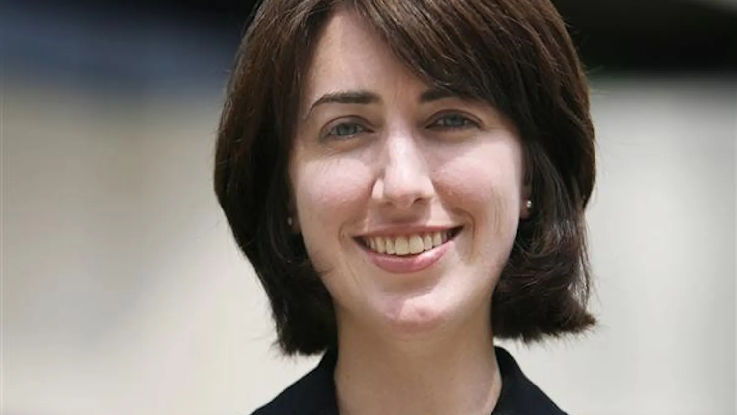 Newly appointed Director of Undergraduate Programming, Kathleen Robbins, stands for a portrait outside the business school.