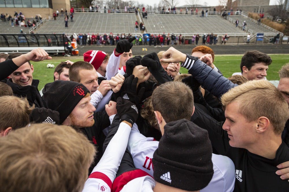 <p>The IU men's soccer team joins hands after Coach Todd Yeagleys victory speech Nov. 18 at Bill Armstrong Stadium. IU defeated the University of Connecticut 4-0 in the second round of the NCAA Tournament. Senior defender Andrew Gutman tallied his 11th goal of the season in the 17th minute.&nbsp;</p>