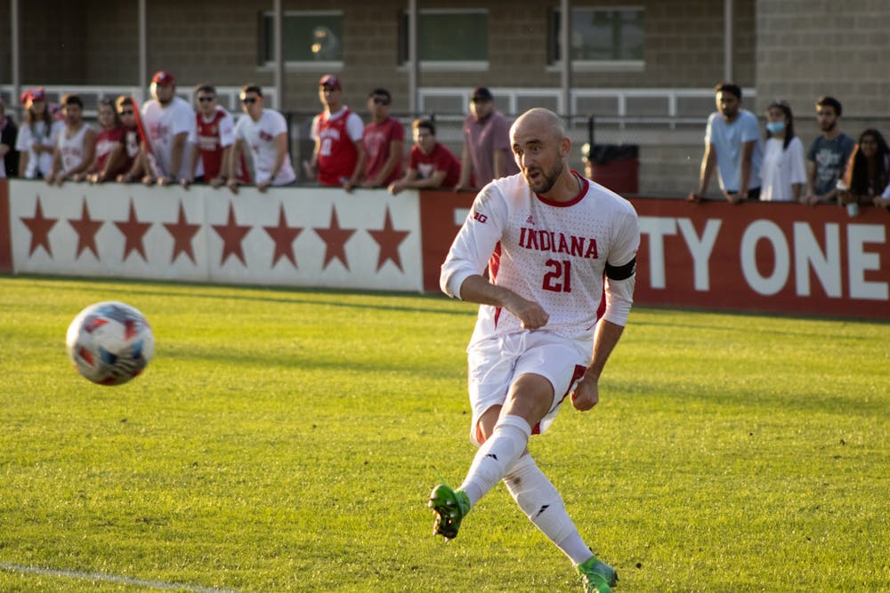 <p>Senior defender Spencer Glass passes the ball Oct. 1, 2021. Indiana has now lost 3 of its last 4 home games.</p>