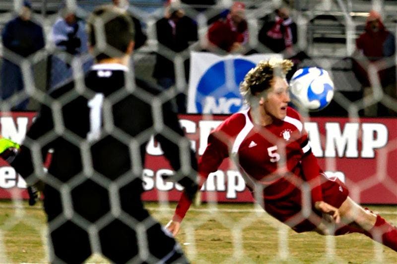 Senior midfielder Brad Ring attempts a header goal shot during the Hoosers 3-0 win over Michigan Saturday night at Bill Armstrong Stadium.