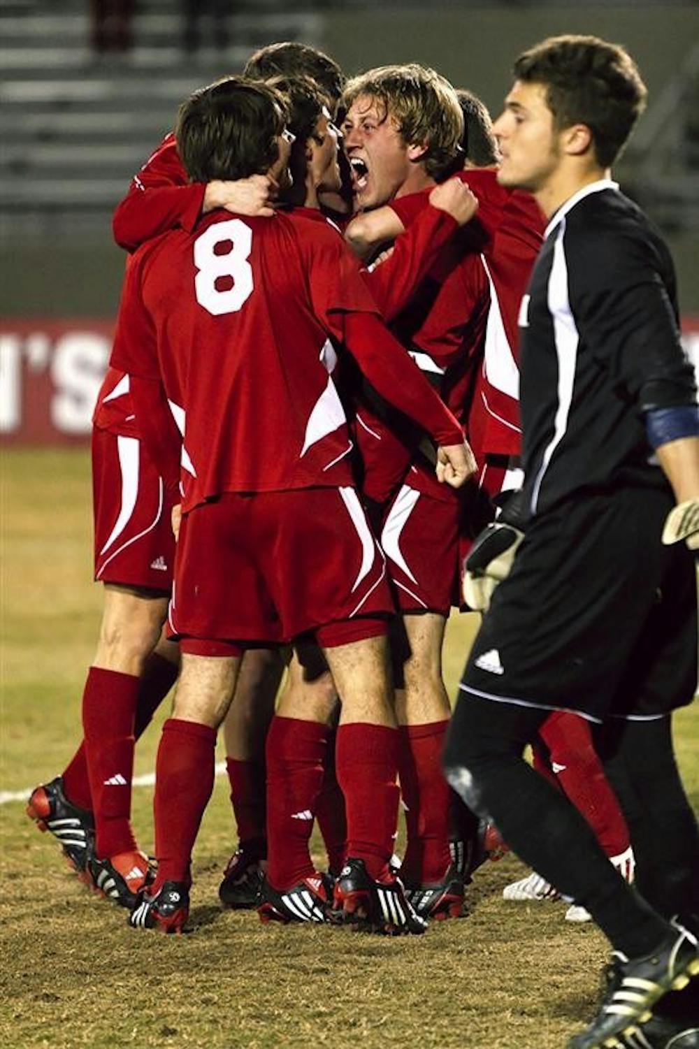 Senior midfielder Brad Ring (center) celebrates with teammates following his first goal of the season in the 77th minute of the Hoosiers 3-0 NCAA Tournament win Saturday against Michigan at Bill Armstrong Stadium.