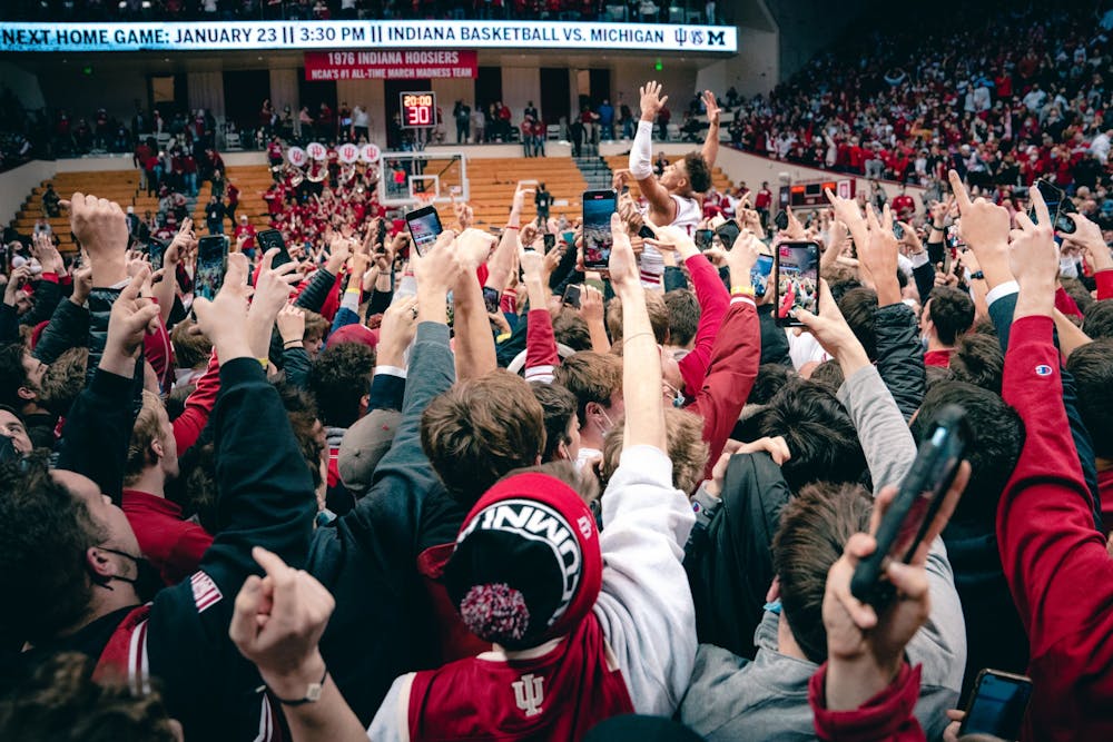 <p>Senior guard Rob Phinisee is hoisted above the crowd by his teammates after IU beat no. 4 Purdue 68-65. Phinisee hit a go ahead 3-pointer with under a minute left in the game.</p>