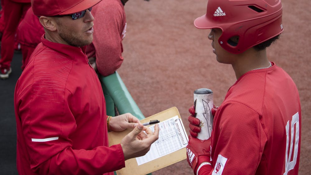 Then-sophomore infielder Justin Walker talks to IU baseball head coach Jeff Mercer at Bart Kaufman Field on April 28, 2019. Indiana earned an important series win against Minnesota this past weekend.