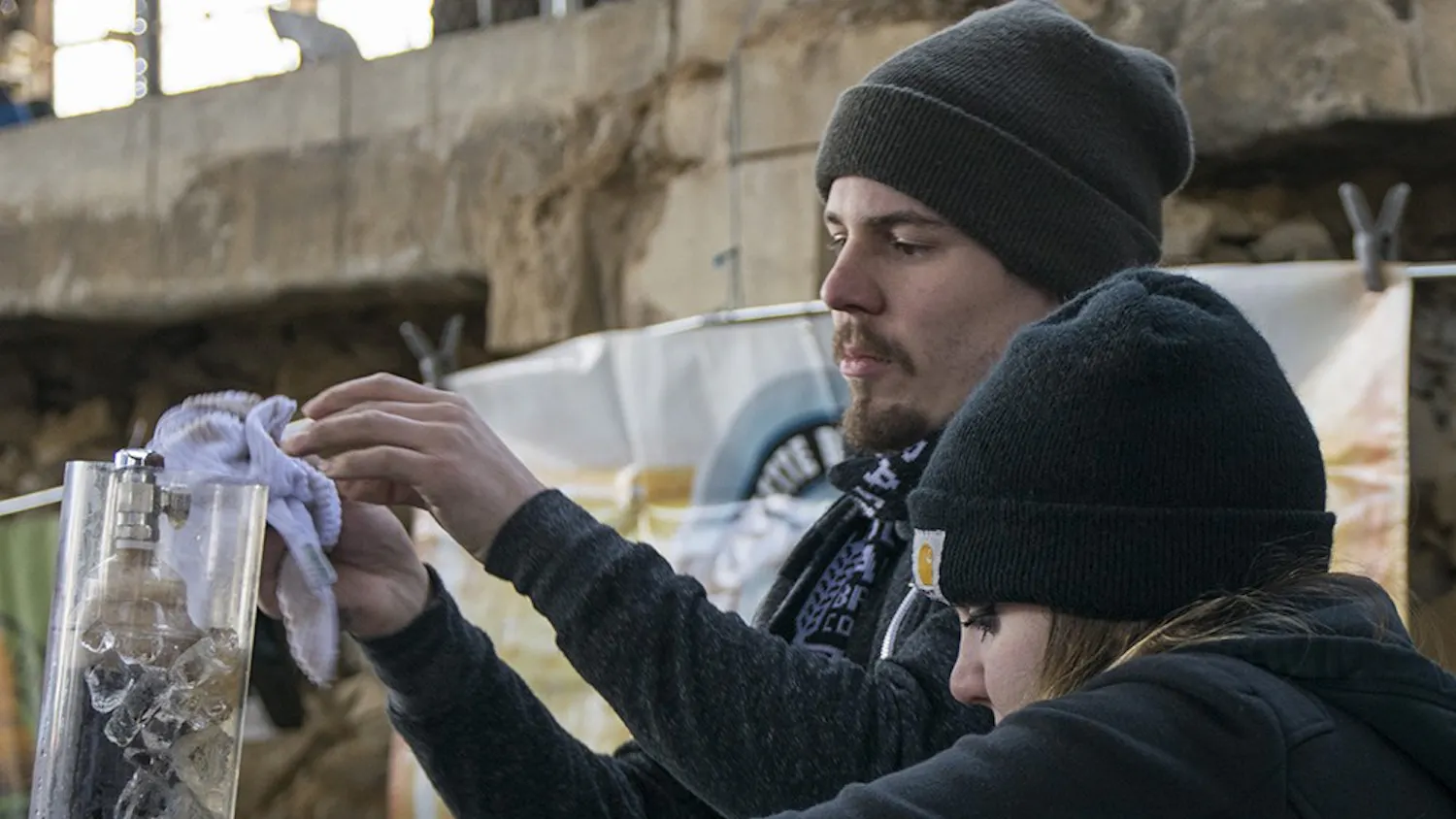 Stacy Spellman, left, and Patrick Schwomeyer hand out beer during the sixth annual Bloomington Craft Beer Festival at Woolery Mill on Saturday afternoon. People can taste hundreds of local and regional draft beers during the festival that is organized by Brewers of Indiana Guild, a non-profit trade association that provides services for Indiana’s craft breweries.
