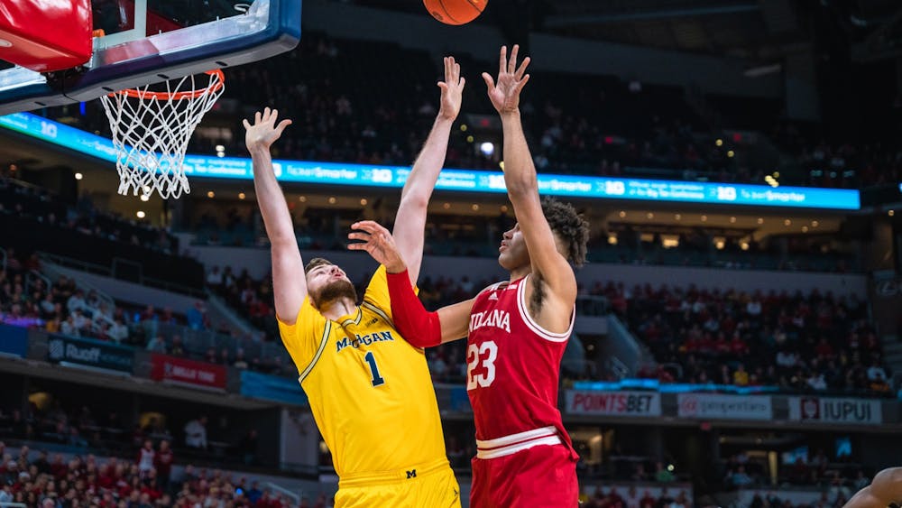 Sophomore forward Trayce Jackson-Davis shoots over Michigan&#x27;s Hunter Dickinson March 10, 2022, at Gainbridge Fieldhouse in Indianapolis, Indiana. Indiana’s comeback was largely led by junior forward Trayce Jackson-Davis, who scored 19 points in the second half.