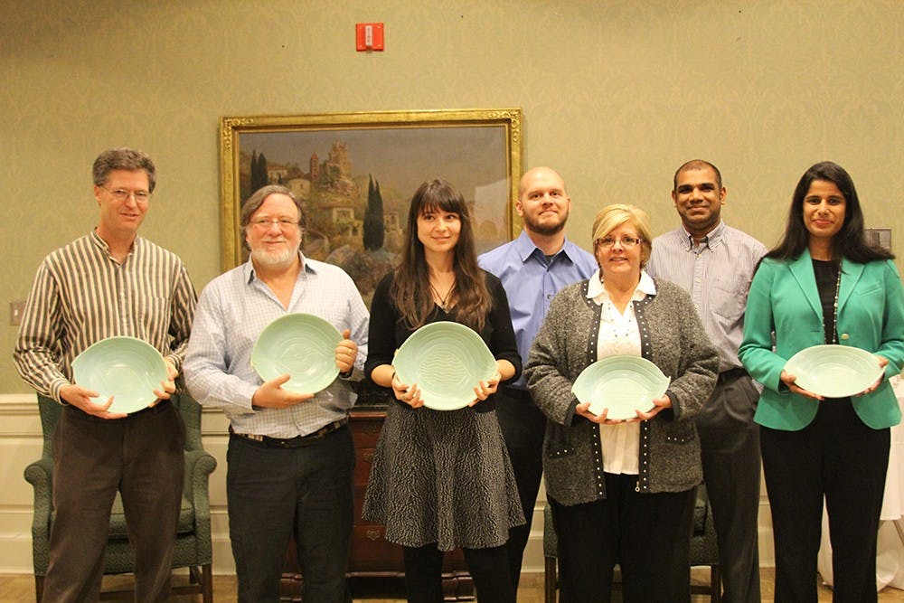 Campus Catalyst Award winners are, from left, Peter Todd, Richard Wilk, Angela Babb, Tim Lewis, Carol Lewis and Boby Joseph of the Auxiliary Information Technology Team, and Shahzeen Attari.