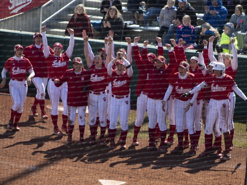 The IU softball team cheers on then-sophomore Grayson Radcliffe on March 17, 2019, after she hit a grand slam against Saint Francis University. The Hoosiers scored two wins against Wisconsin on Saturday, as well as a win and a loss against Minnesota on Sunday. 
