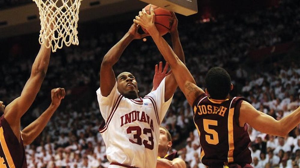 IU guard Devan Dumes goes up for a shot during the first half of IU's 67-63 loss to No. 21 Minnesota on Sunday at Assembly Hall. Dumes had 19 points in the game.