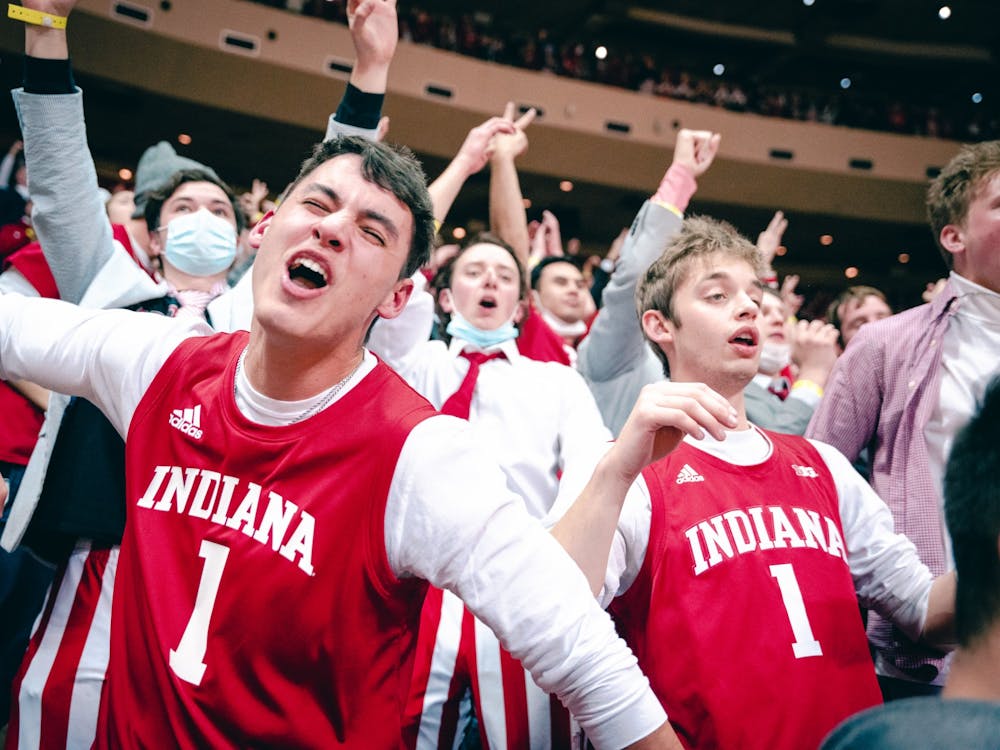 IU sophomore Alex Snively cheers after Indiana scored a 3-pointer in the first half of the game against Purdue. Indiana men’s basketball defeated Purdue 68-65 on Jan. 21 at Simon Skjodt Assembly Hall.