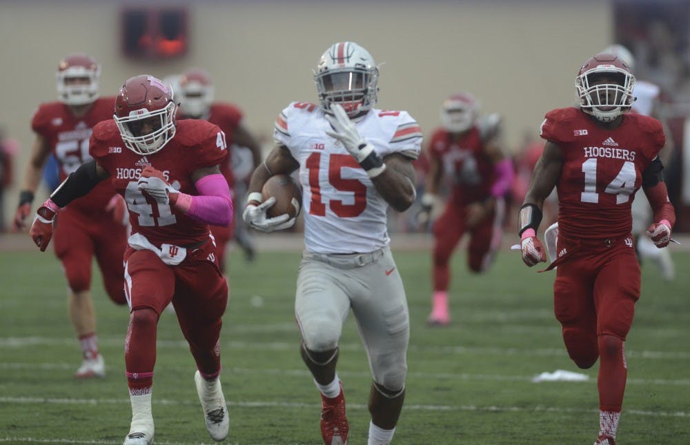Linebacker Clyde Newton (41) and Cornerback Andre Brown, Jr. (14) chase down Ohio State's running back Ezekiel Elliot (15) as he runs it in for a touchdown at Memorial Stadium. The Hoosiers lost to the number one ranked Buckeyes, 27-34.