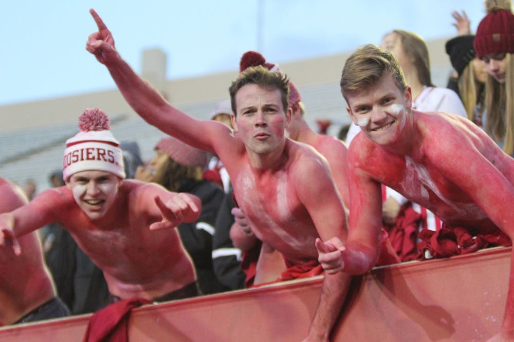 Shirtless IU fans in the student section show their support before the game begins Nov. 2 at Memorial Stadium. IU won against Northwestern 34-3.