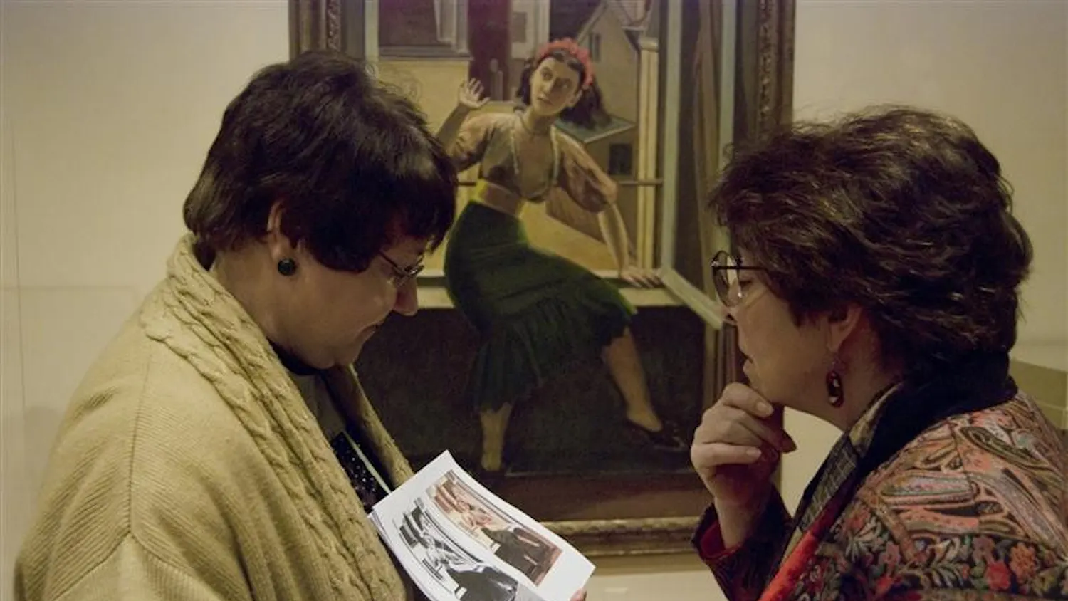 Docent Tina Jernigan shows the first and final copies of Balthus's The Window to Indianapolis resident Janice Mutch during a tour at the IU Art Museum Saturday afternoon. The tour, called Fashion Across Time, explored styles from early humanity to the Middle Ages to modern times.