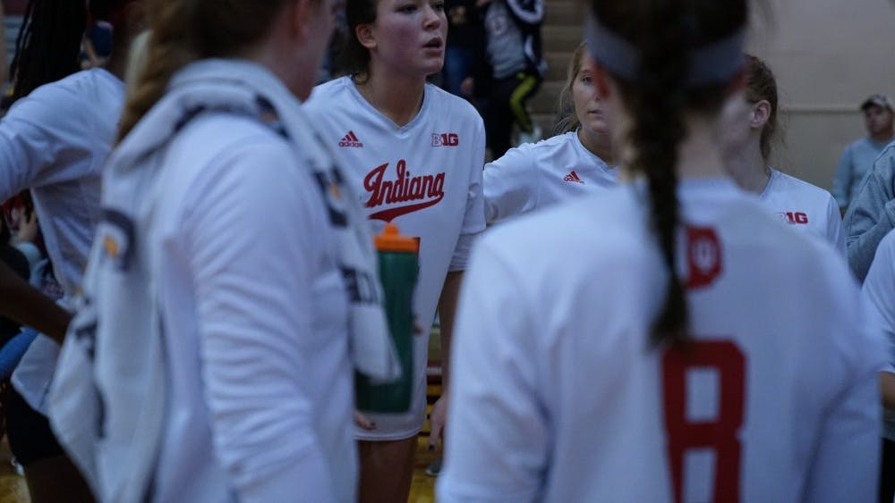 Senior right side hitter Elizabeth Asdell gives words of encouragement to her teammates during a huddle Nov. 17 in University Gym. IU lost to Nebraska 0-3, setting its season record to 16-13.