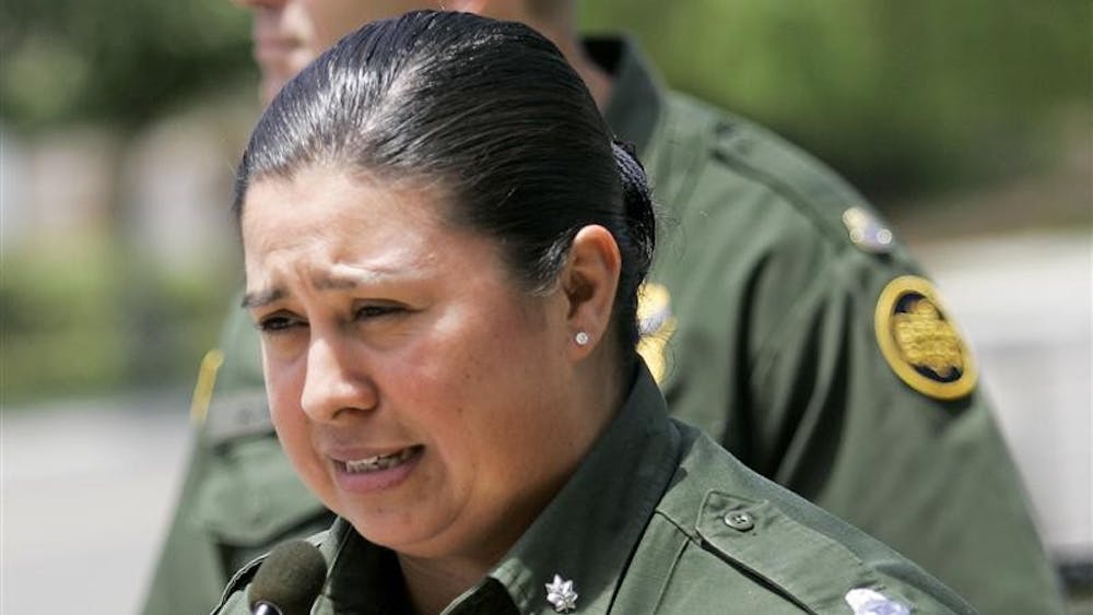 United States Border Patrol Gloria Chavez, the agent in charge of the Chula Vista, Calif.,  sector, shows her emotion as she speaks at a news conference regarding the murder of agent Robert Rosas  Friday, July 24, 2009, in Chula Vista.